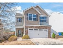 Charming two-story home with a brick and siding facade and a two-car garage, inviting curb appeal at 684 Cape Fear St, Fort Mill, SC 29715