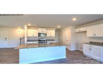 Charming kitchen with granite countertops, modern appliances, and a large island at 1054 Horizon Ln, Chester, SC 29706