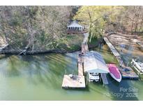 Aerial view of waterfront property showing the house, boat dock, and lake access for recreational enjoyment at 1657 Bowater Rd, Rock Hill, SC 29732