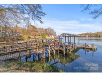 Waterfront home with private covered dock and boat slip for easy lake access and serene relaxation at 1657 Bowater Rd, Rock Hill, SC 29732