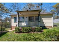 Charming home with a covered front porch and well-maintained landscaping at 300 Bell St # 80, Mount Holly, NC 28120