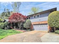 Beautiful home with a two-car garage, manicured lawn, and vibrant landscaping at 501 Eastwood Dr, Gastonia, NC 28054