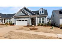 Charming one-story home with attached garage and manicured front lawn under a blue sky at 8016 Brookbank Dr, Charlotte, NC 28269