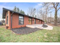 Charming brick home featuring well-maintained landscaping and a welcoming front entrance, blending classic style with modern accents at 845 2Nd Nw St, Hickory, NC 28601