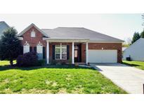 Charming one-story brick home with a well-manicured lawn and attached two-car garage at 1021 Glen Laurel Dr, Fort Mill, SC 29707