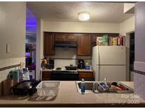 Functional kitchen featuring essential appliances and ample counter space, ready for your culinary adventures at 11024 Harrowfield Rd, Charlotte, NC 28226