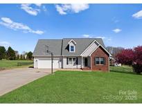 Charming single-Gathering home with a basketball hoop, well-kept lawn, and a brick-accented facade at 238 Lippard Springs Cir, Statesville, NC 28677