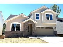 New two-story home features a stone front entryway and a two-car garage at 9842 Quercus Ln, Huntersville, NC 28078