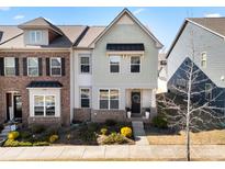 Charming townhome with a well-maintained front yard and inviting entrance, showcasing curb appeal at 10914 Zac Hill Rd, Davidson, NC 28036