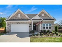 Charming single-Gathering home boasting a two-car garage and well-maintained lawn at 3054 Constitution Ln, Gastonia, NC 28056