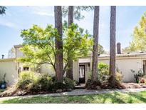 Charming home featuring mature landscaping, including tall trees that accentuate the entrance at 3709 Willow Point Dr, Charlotte, NC 28277