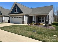 Charming single-story home with a well-manicured lawn, gray siding, and a welcoming entrance at 906 Wisteria Way, Salisbury, NC 28146