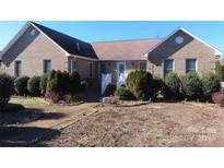 Charming single-story brick home with a well-manicured front yard and inviting walkway to the front door at 139 Sain Rd, Statesville, NC 28625