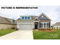 Charming single-Gathering home featuring stone accents, a two-car garage, and a well-maintained lawn at 122 N Shayna Rd, Troutman, NC 28166