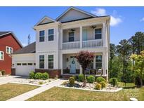Charming two-story home with a welcoming front porch and beautifully landscaped front yard and a two car garage at 1274 Fishing Creek Rd # 134, Clover, SC 29710