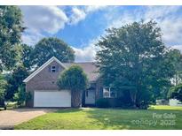 Charming brick home with a two-car garage and lush landscaping at 201 Fancy Lady Ct, York, SC 29745