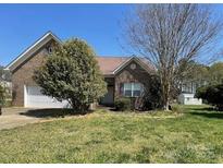 Charming brick home with a two-car garage and a well-maintained front yard at 201 Fancy Lady Ct, York, SC 29745
