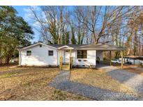 Charming single-story home featuring a covered carport and a welcoming front porch at 2706 Booker St, Gastonia, NC 28054