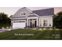 Charming home with a two-car garage, landscaped yard, and a cozy front porch at 4 Five Creek Rd # 4, Charlotte, NC 28213