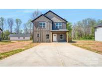 Charming two-story home with a long driveway and neutral color palette at 51 36Th Nw St, Hickory, NC 28601
