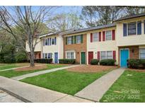 Charming townhomes featuring colorful doors, shutters and well-maintained lawns at 1113 Keswick Pl # 118, Monroe, NC 28112