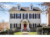 Charming two-story home with dormer windows, black shutters, and a welcoming red front door at 14024 Alley Son St, Huntersville, NC 28078