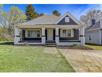 Charming single-story home featuring a covered front porch and well-maintained lawn in a quiet neighborhood at 209 N Yadkin Ave, Spencer, NC 28159