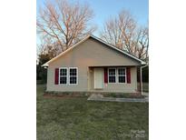 Charming single-story home with red shutters and a well-maintained front yard at 1320 Beaconfield Ct, Rock Hill, SC 29730