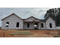 New construction home featuring a covered porch and modern design, currently under construction at 1429 Coppergate Dr, Salisbury, NC 28147