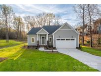 Charming single-Gathering home with a well-manicured lawn and inviting two-car garage, perfect for suburban living at 9849 Rich Hatchet Rd, Huntersville, NC 28078