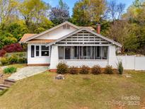 Charming craftsman-style home with a screened-in porch and mature landscaping at 165 Mimosa Ter, Wadesboro, NC 28170