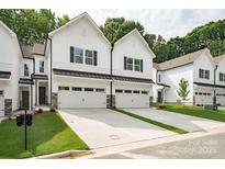 Charming new construction featuring attached garages and modern farmhouse design at 19751 Feriba Pl, Cornelius, NC 28031