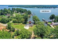 Lake Norman property with stunning waterfront views, sprawling lawn, and a charming single-Gathering home at 4980 Kiser Island Rd, Terrell, NC 28682