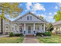 Charming home featuring a lovely front porch, manicured landscaping, and classic architectural details at 806 Sunnyside Ave, Charlotte, NC 28204