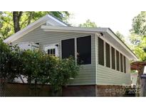 Exterior view of home showcasing a quaint sunroom addition at 128 Twin Bluff Trl # C52, Mount Gilead, NC 27306