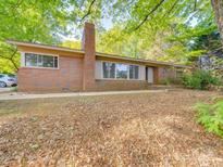 Charming brick home featuring a classic architectural design and lush green surroundings at 1881 Sharonwood Ln, Rock Hill, SC 29732