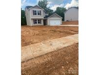 Charming two-story home features a one car garage and is located on a spacious lot at 438 Phifer Rd, Kings Mountain, NC 28086