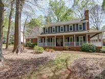 Charming two-story home featuring a welcoming front porch and beautiful landscaping at 940 Brittany Ct # 23, Gastonia, NC 28056