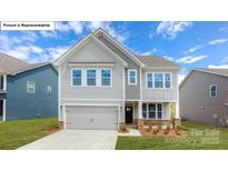 Charming two-story home with a two-car garage and well-maintained landscaping at 158 Ventor Way, Mooresville, NC 28115