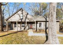 Charming single-story home with covered porch and well-maintained lawn in a peaceful neighborhood at 2124 Marquesas Ave, Tega Cay, SC 29708