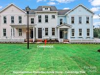 Charming new construction townhomes featuring inviting front porches and well-manicured landscaping at 282 Gilead Rd, Huntersville, NC 28078