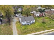 Charming blue home with updated roof and lovely landscaping, nestled amongst mature trees at 2420 Kannapolis Hwy, Concord, NC 28027