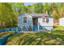 Charming home featuring an inviting front porch, new paint, and a well-manicured front yard at 4445 Pioneer Dr, Hickory, NC 28601