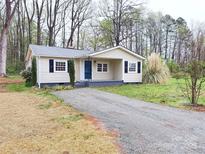 Charming single story home with black shutters and a gravel driveway at 512 Hall St, Salisbury, NC 28144