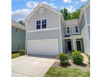 Charming two-story home with a two-car garage and manicured lawn at 14022 Clayborn St, Midland, NC 28107