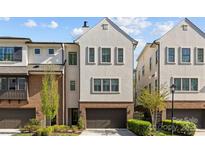 Charming townhome showcasing a modern architectural design, beautiful landscaping, and an attached two-car garage at 4038 City Homes Pl, Charlotte, NC 28209