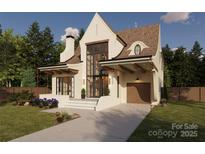 Charming two-story home featuring a modern design, a gable roof, and a large front yard at 2131 Bay St, Charlotte, NC 28205