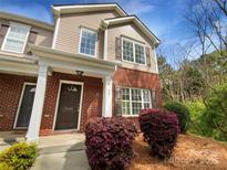 Charming two-story townhome with brick and siding, featuring a well-manicured front yard at 3155 Golden Dale Ln, Charlotte, NC 28262