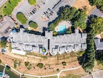 Stunning aerial view of the community, showcasing the pool, parking, and landscaping at 637 Williamson Rd # 304, Mooresville, NC 28117