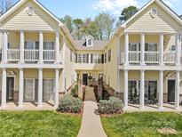 Charming townhome with covered patios, white columns, and manicured landscaping for inviting curb appeal at 1386 21St Ne Ave, Hickory, NC 28601